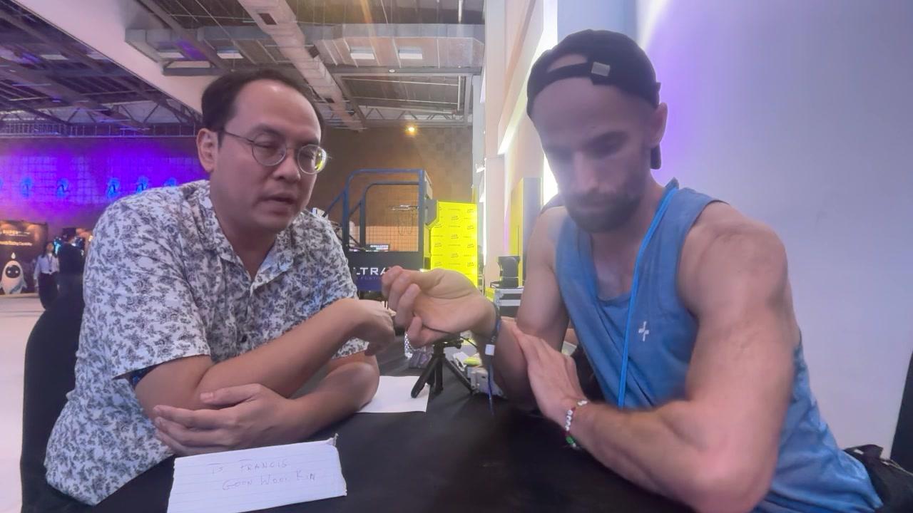 Francis Goon explaining the handheld biosensor